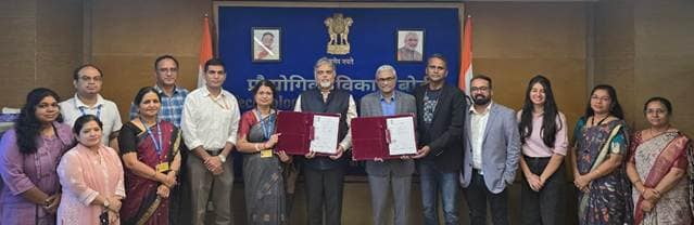 India’s ₹150 Crore Quantum Security Push: What It Means, in Simple Words 1 Group of officials and company representatives holding signed agreement folders at the TDB and QNu Labs signing ceremony