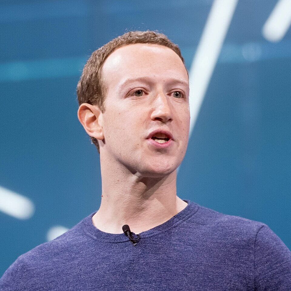 Meta-Zuckerberg Apology Row: How PM Modi's Video Removal Sparked India's Biggest Tech-Politics Showdown 1 Mark Zuckerberg and Meta logo beside Indian Parliament building, representing the Meta-Modi video apology row